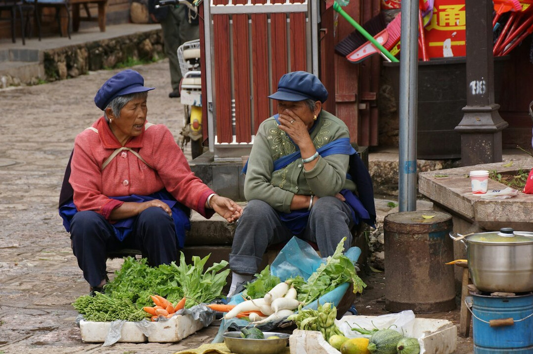 women at market stall