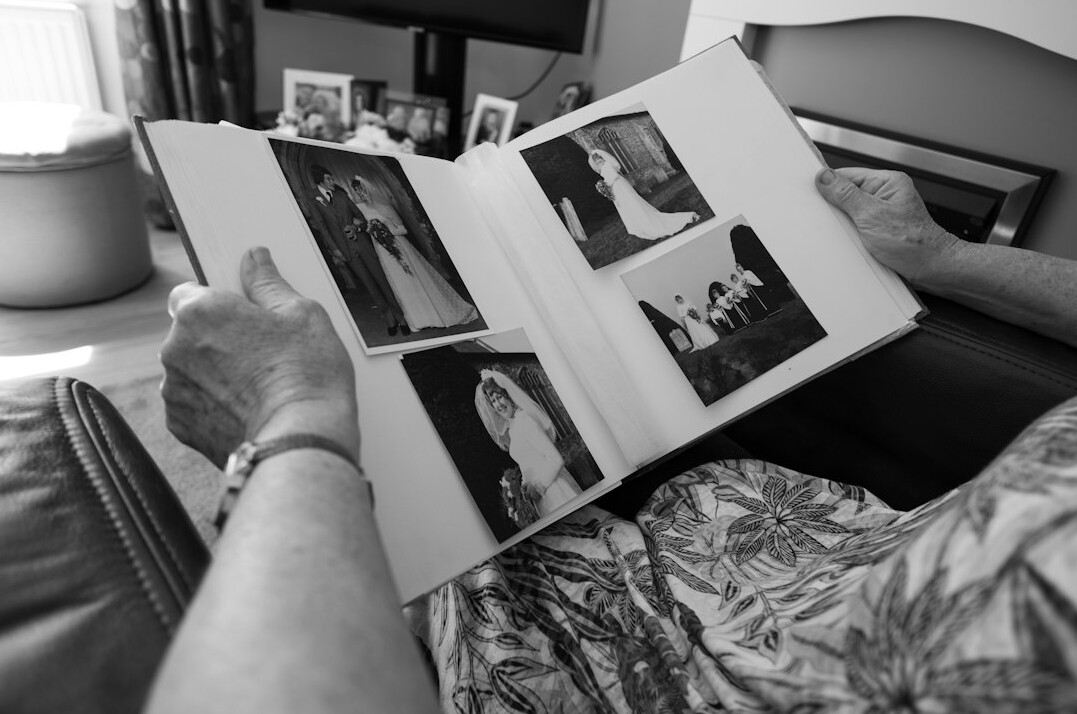 retired teacher showing old photos