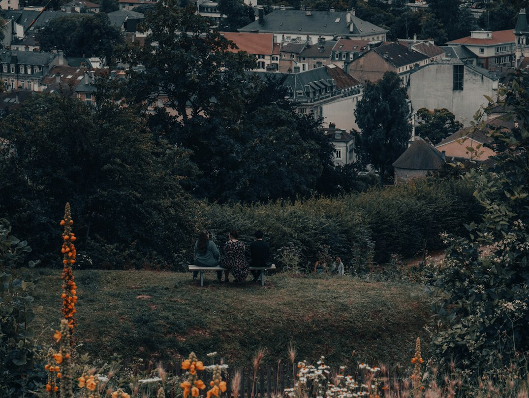 elderly neighbors chatting in garden